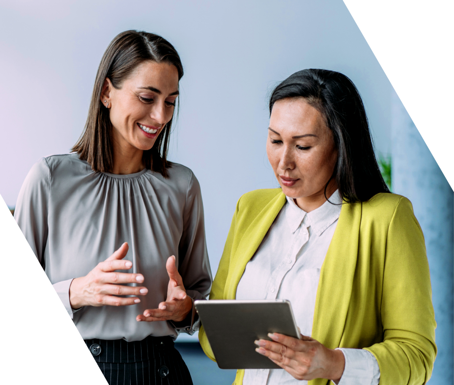 Two women looking at an iPad