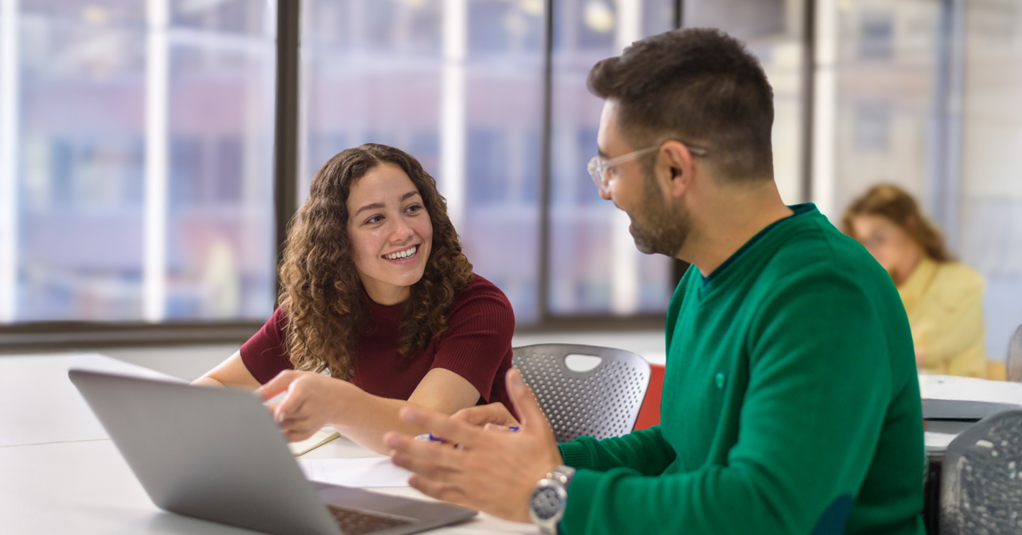 A man and a woman collaborating