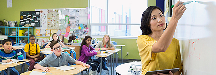 Teacher and students in classroom.